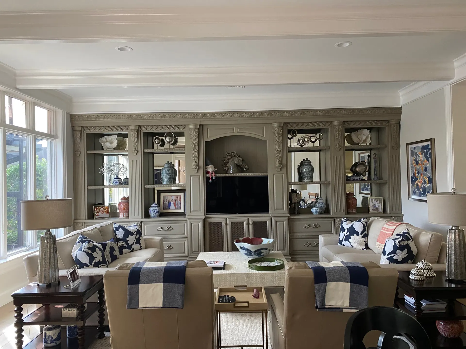 A cozy living room featuring two couches and a television against a neutral wall.